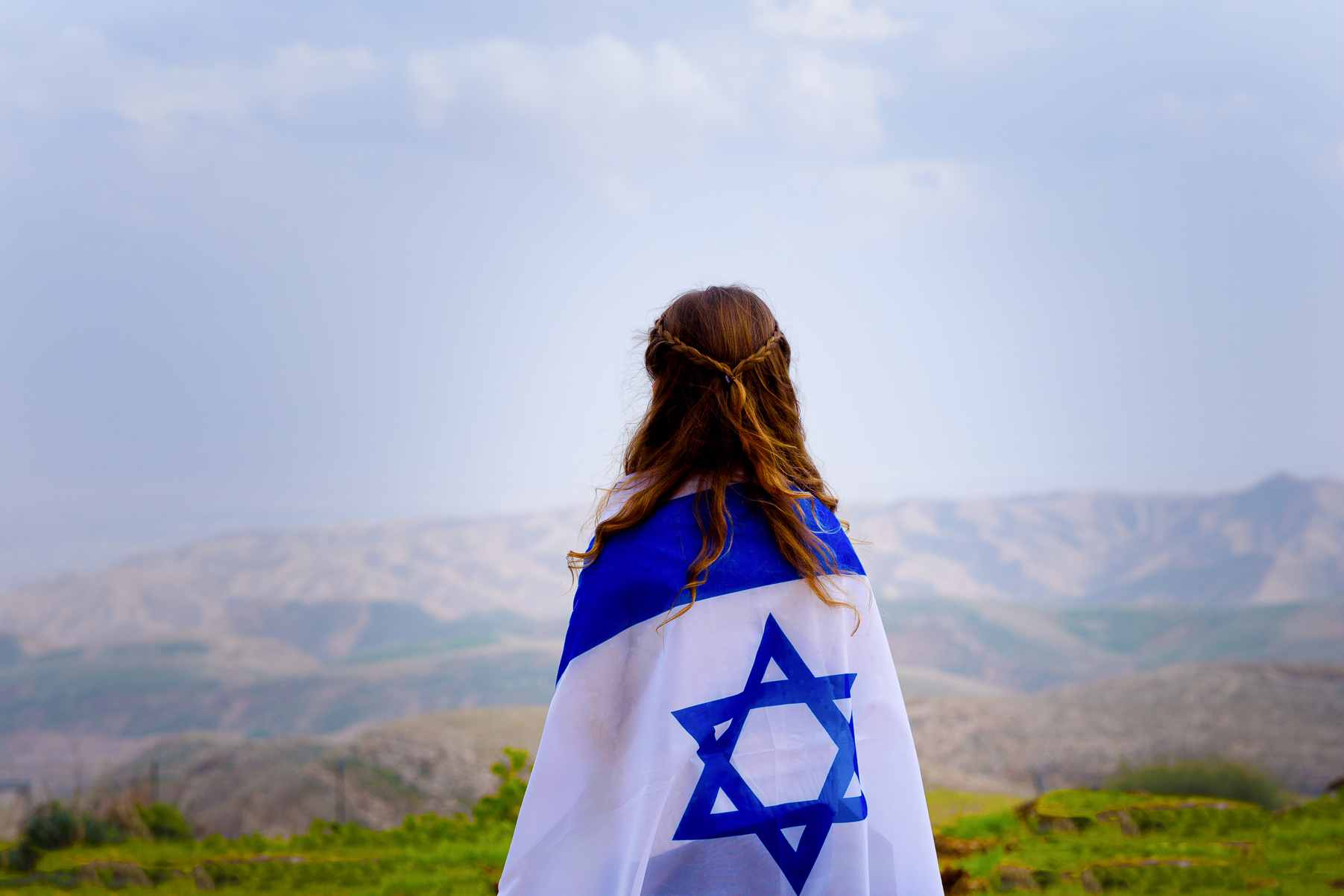 Little Girl Wrapped in Israel Flag